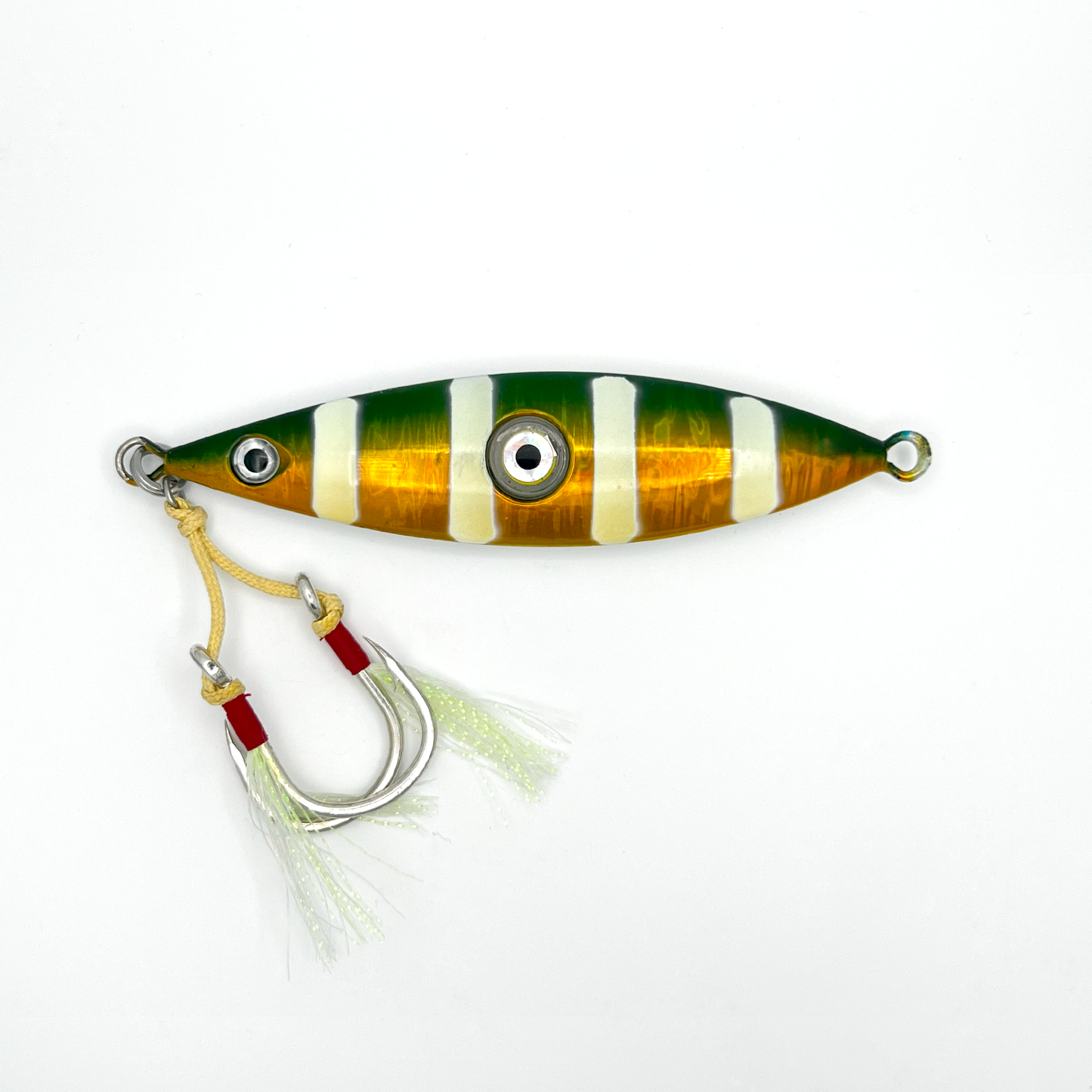 Green-Gold lure. Green top and gold body with four horizontal white stripes, two hooks with skirts, and light-up eye in center.