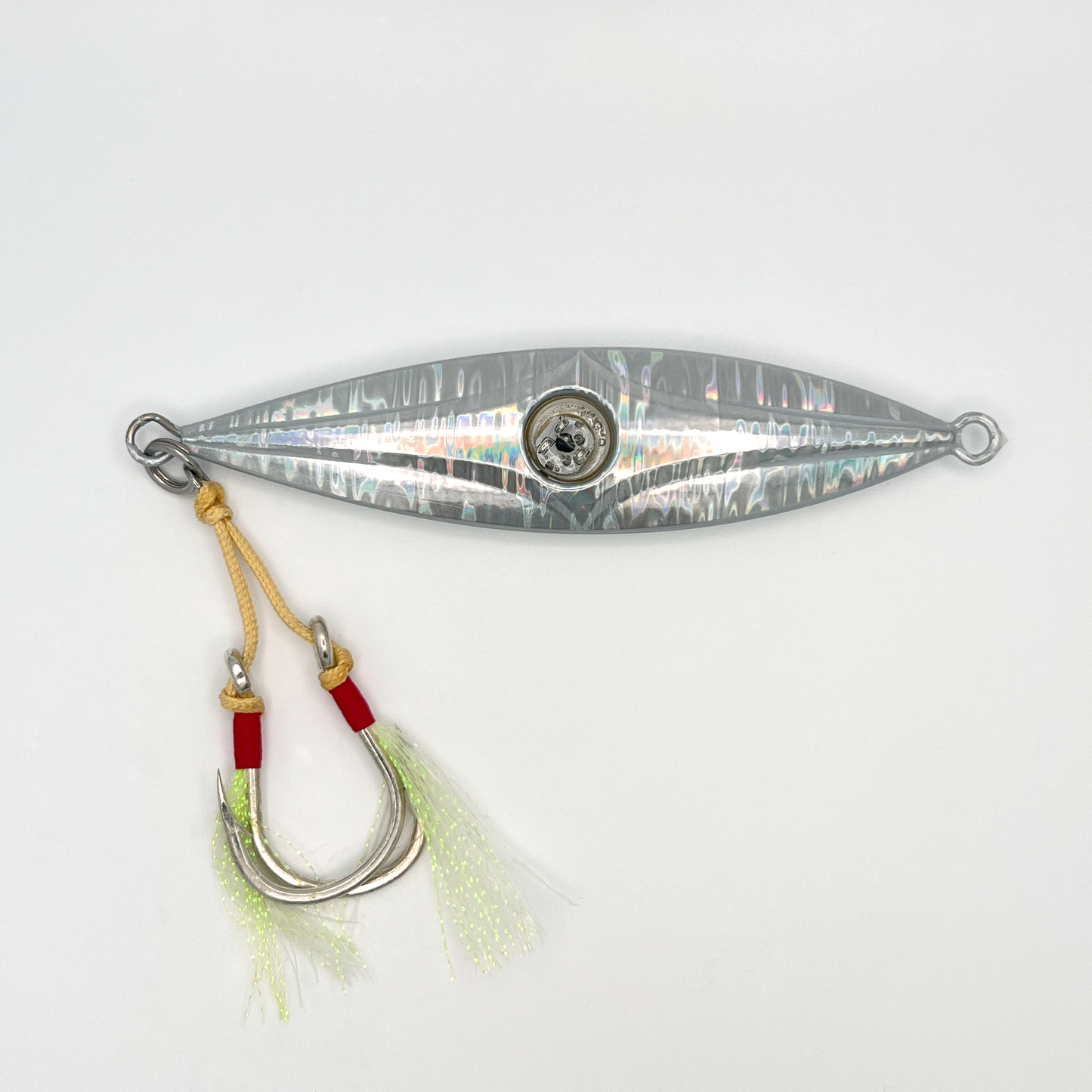 Back of lure showing reflective silver surface and light-up eye in center.